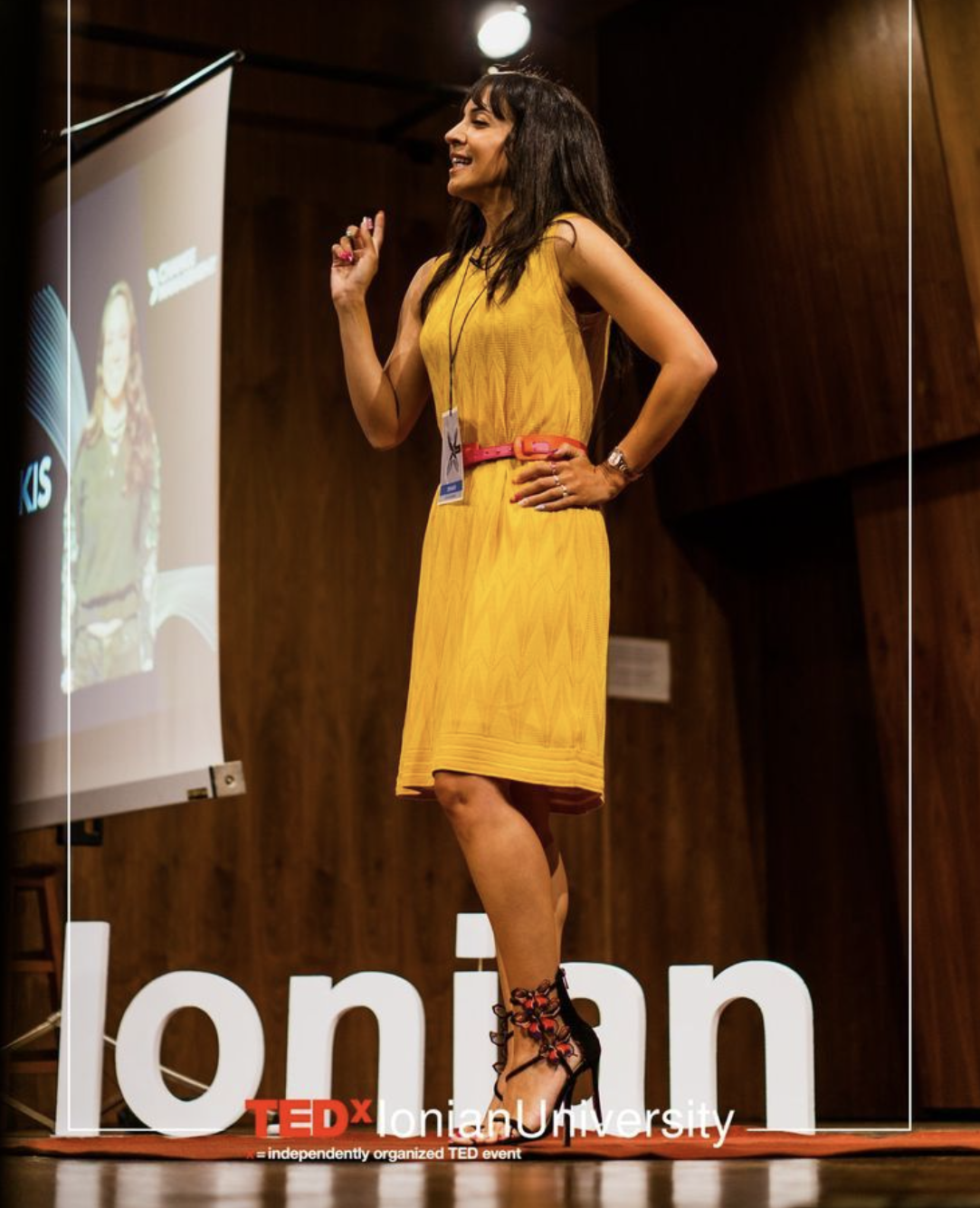 Iné speaking on stage